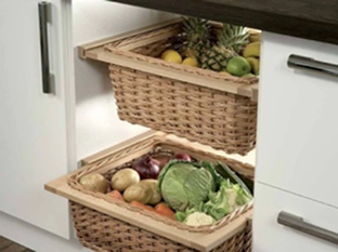 Wicker basket in kitchen drawer for vegetable storage