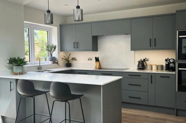 G-shaped kitchen featuring ample workspace and social area